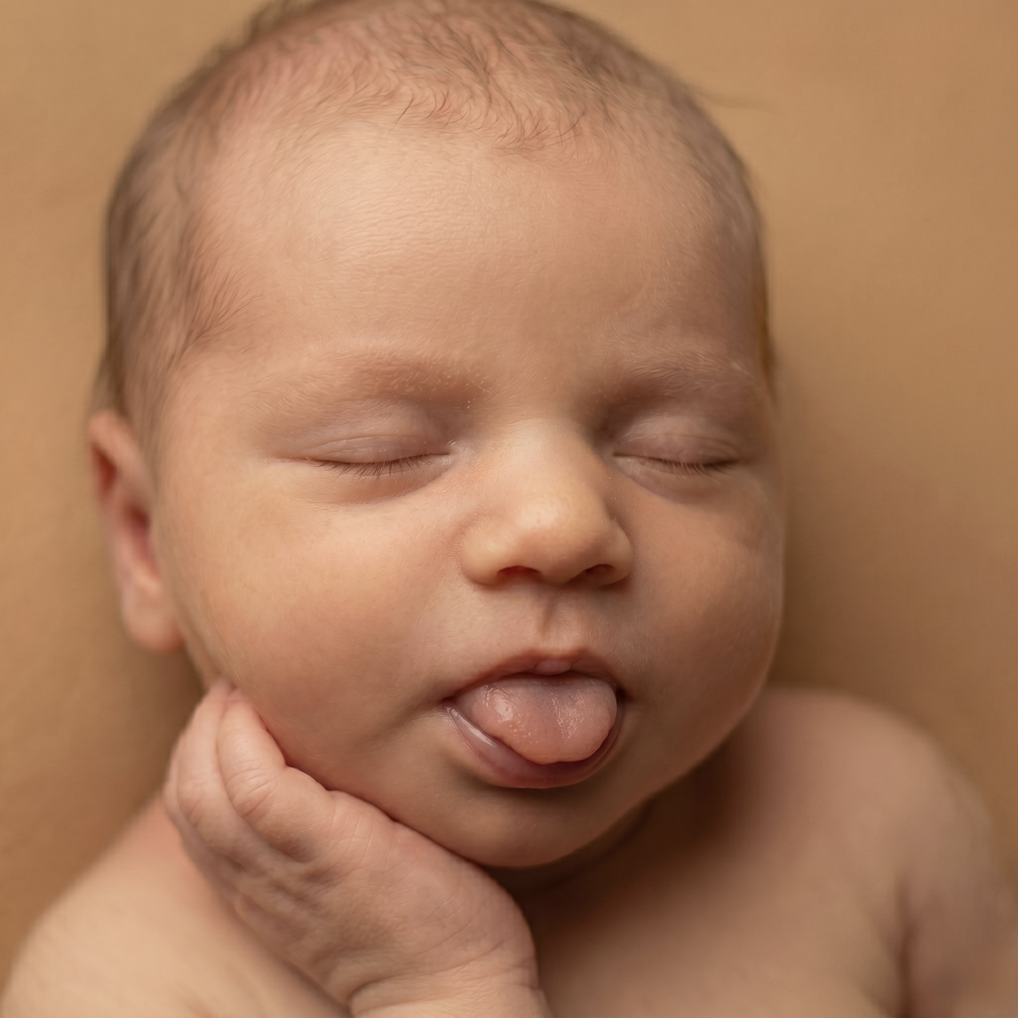 The same 3D scan rendered as a branded photoreal newborn portrait — the kind of deliverable studios can include in keepsake sessions